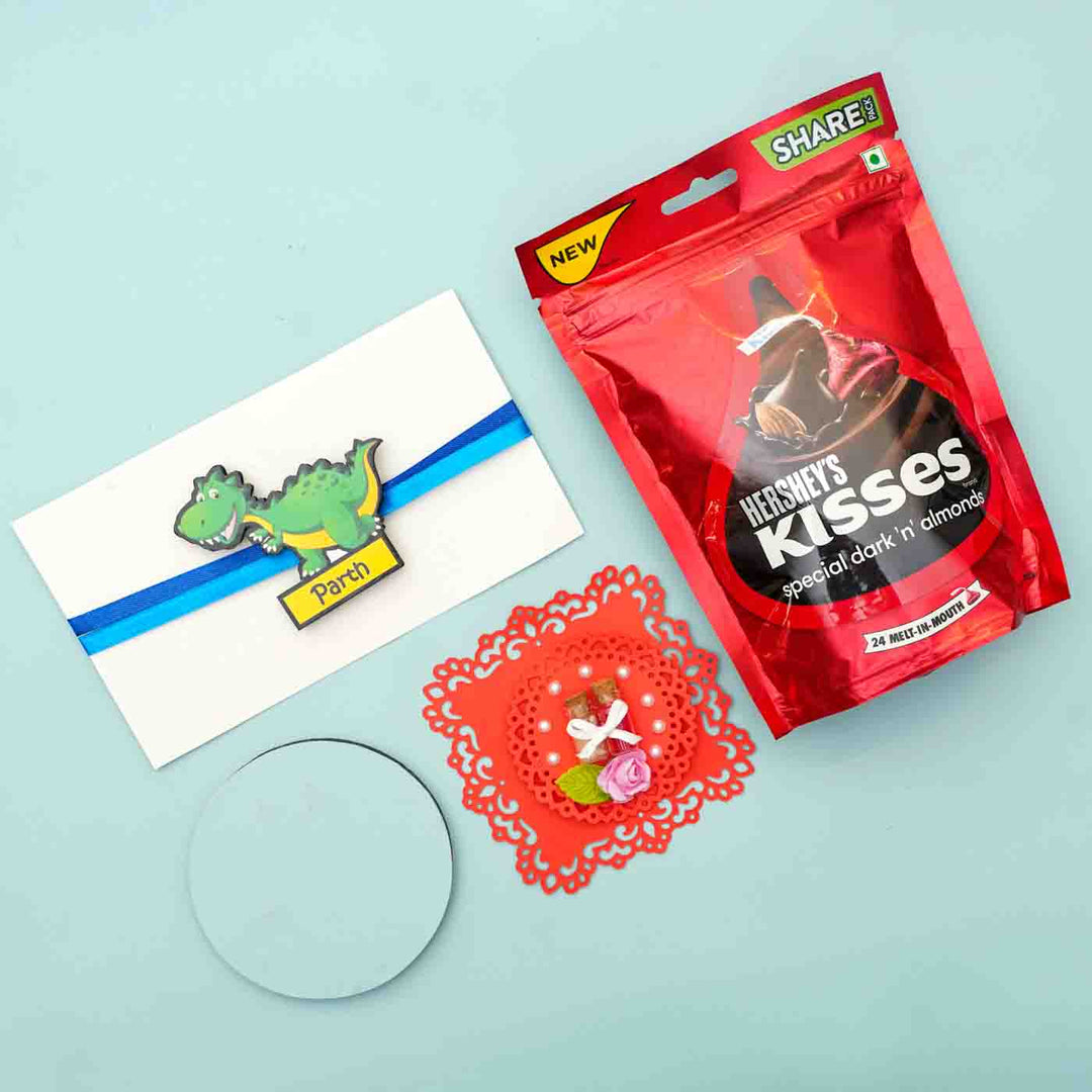 Personalized Reusable X Large Dinosour Mdf Wood Rakhi With Chocolates And Roli Chawal - Gift Card Flat Lay with Candy