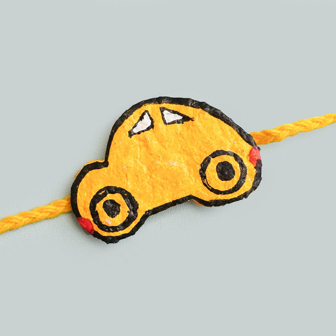 Buy Handmade Ecofriendly Yellow Car Recycled Paper Rakhi With Roli