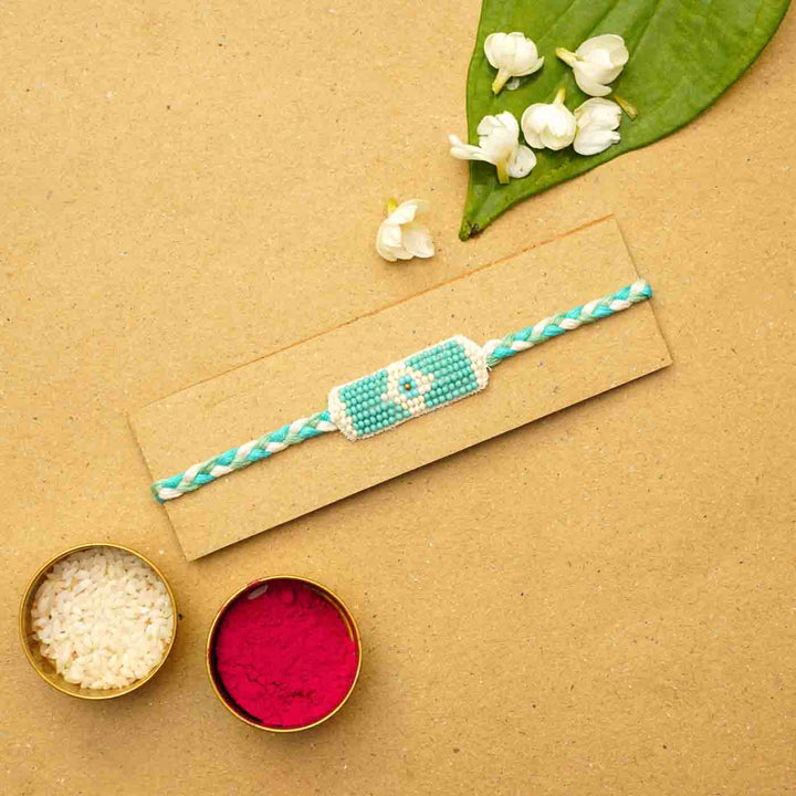 Reusable Beaded Evil Eye Rakhi With Roli Chawal - Bracelet on packaging with decor
