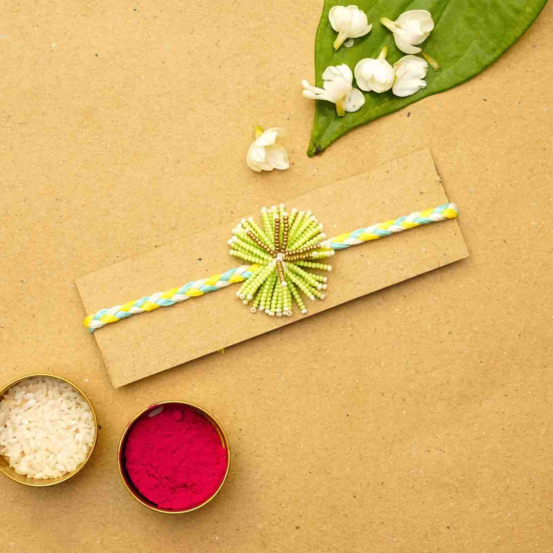 Reusable Beaded Green Flower Rakhi With Roli Chawal - Packaged on display card