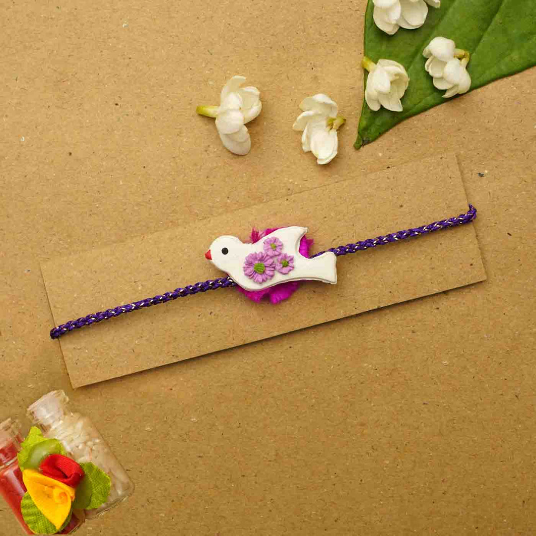Handmade Bird Clay Rakhi With Chocolates & Roli Chawal