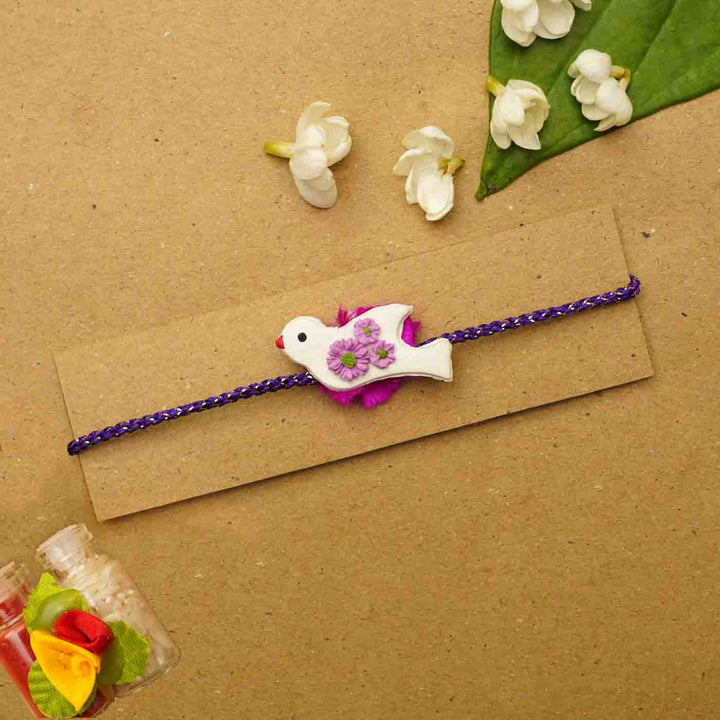 Handmade Bird Clay Rakhi With Chocolates & Roli Chawal