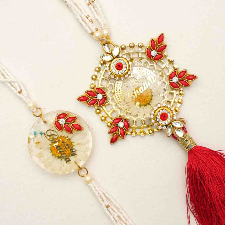 Handmade Resin Lovely Bhaiya And Lovely Bhabhi With Real Flower Rakhi With Chocolates And Roli Chawal Set Of 2 - Close-up of Rakhi pair