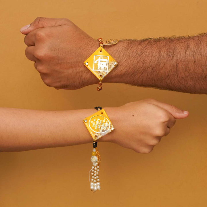 Handmade Resin Sunset Yellow Bhaiya Bhabhi Rakhi With Chocolates And Roli Chawal Set Of 2 - Worn on male and female wrists