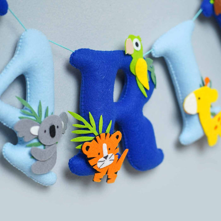 Handcrafted Personalized Jungle Theme Felt Bunting - Close-up of hanging letter garland