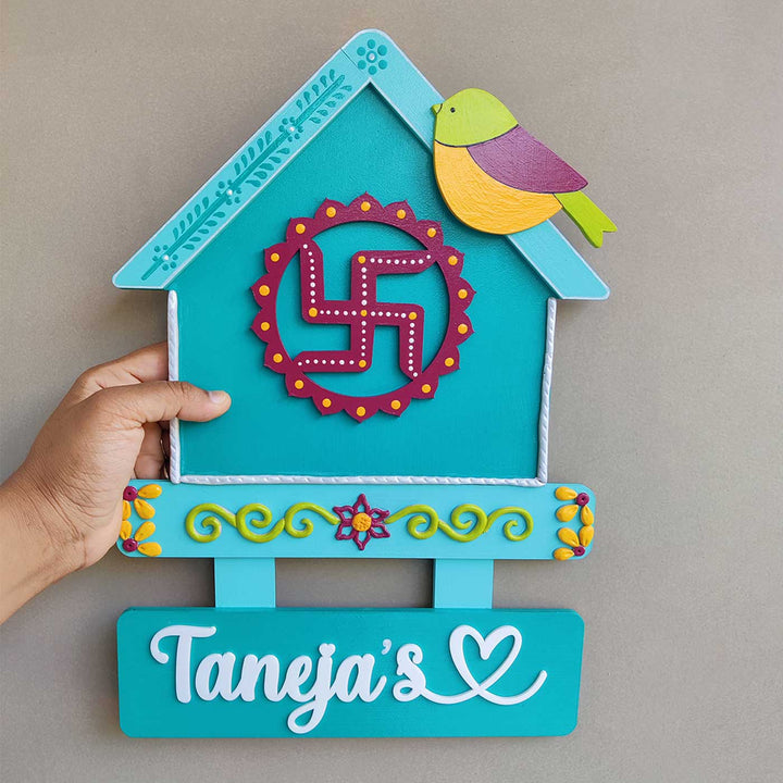 Handcrafted Personalized Swastik House Shaped Nameplate - Hand-Held Front View with Name Plate