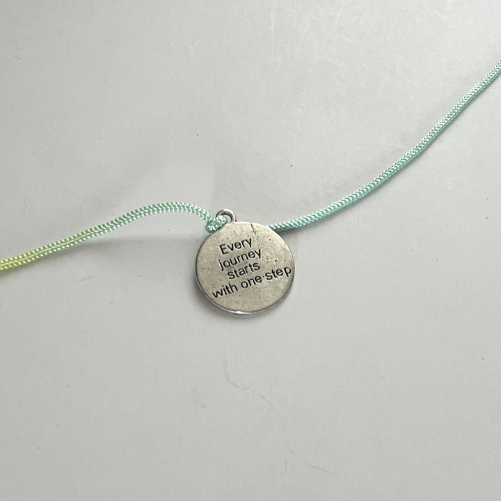 Engraved "Every Journey Starts With One Step" Quote Metal Charm Rakhi With Roli Chawal for Brother
