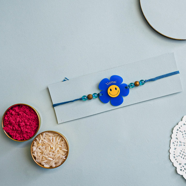 Personalized Handmade Flower Smiley Acrylic Kids Rakhi With Roli Chawal - Packaged with Raksha Items