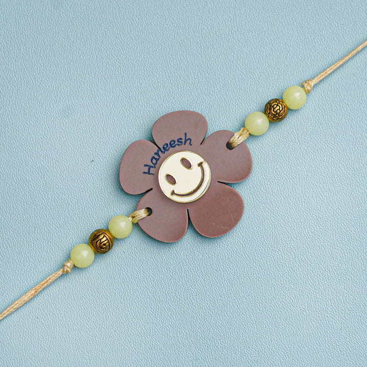 Personalized Handmade Flower Smiley Acrylic Kids Rakhi With Roli Chawal - Close-up Front View (3)