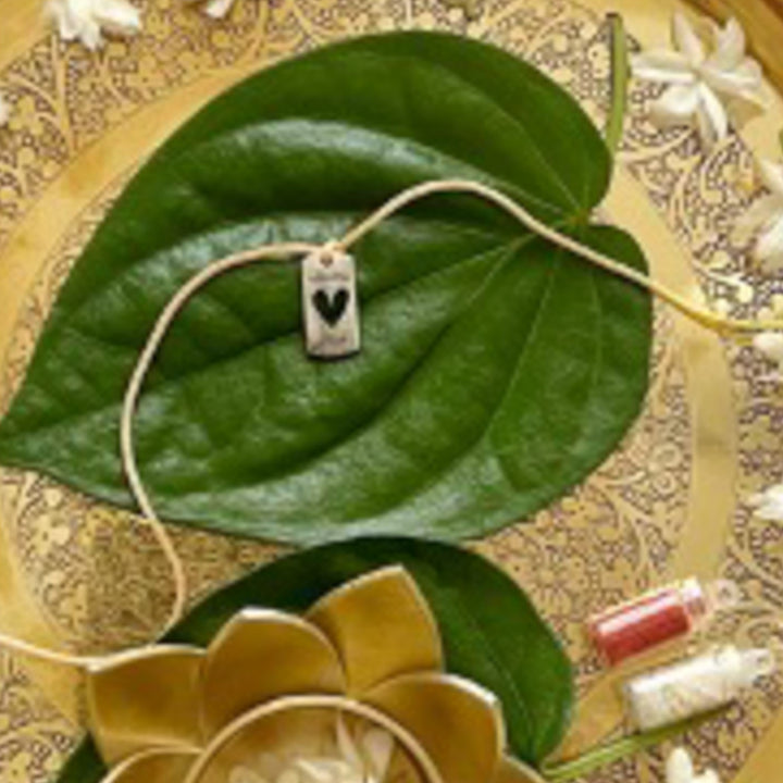Engraved "Follow Your Heart" Quote Metal Charm Rakhi With Roli Chawal for Brother