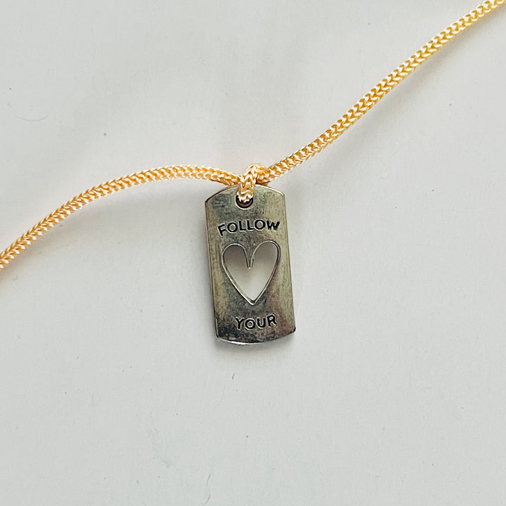 Engraved "Follow Your Heart" Quote Metal Charm Rakhi With Roli Chawal for Brother