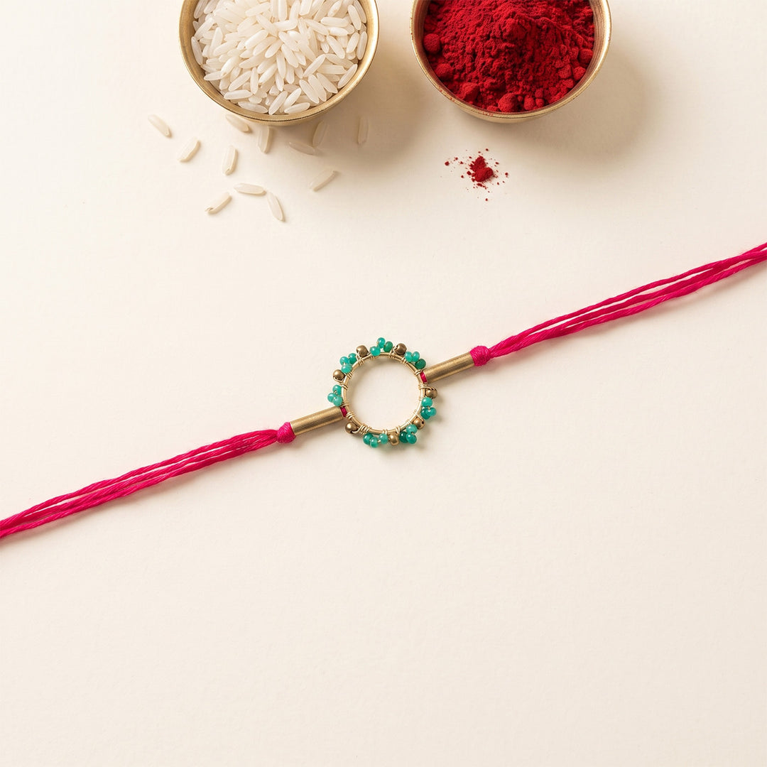 Handcrafted Circle Of Life Brass Rakhi With Roli Chawal For Brother