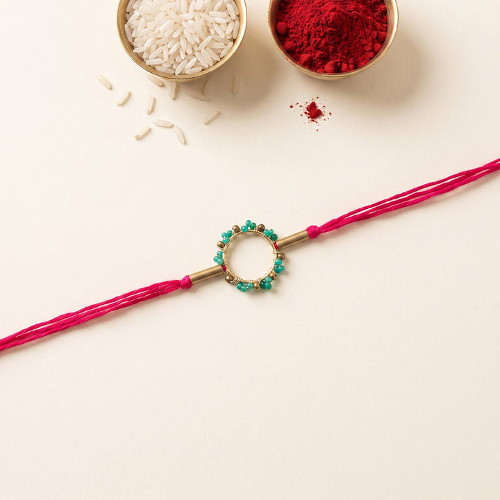 Handcrafted Circle Of Life Brass Rakhi With Roli Chawal For Brother