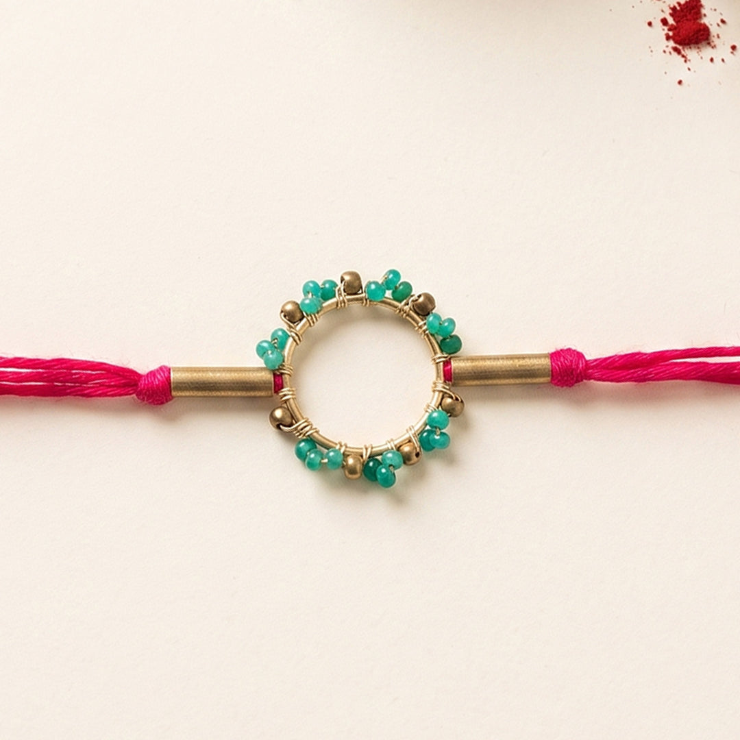 Handcrafted Circle Of Life Brass Rakhi With Roli Chawal For Brother