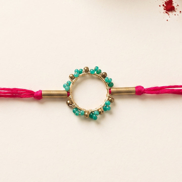 Handcrafted Circle Of Life Brass Rakhi With Roli Chawal For Brother