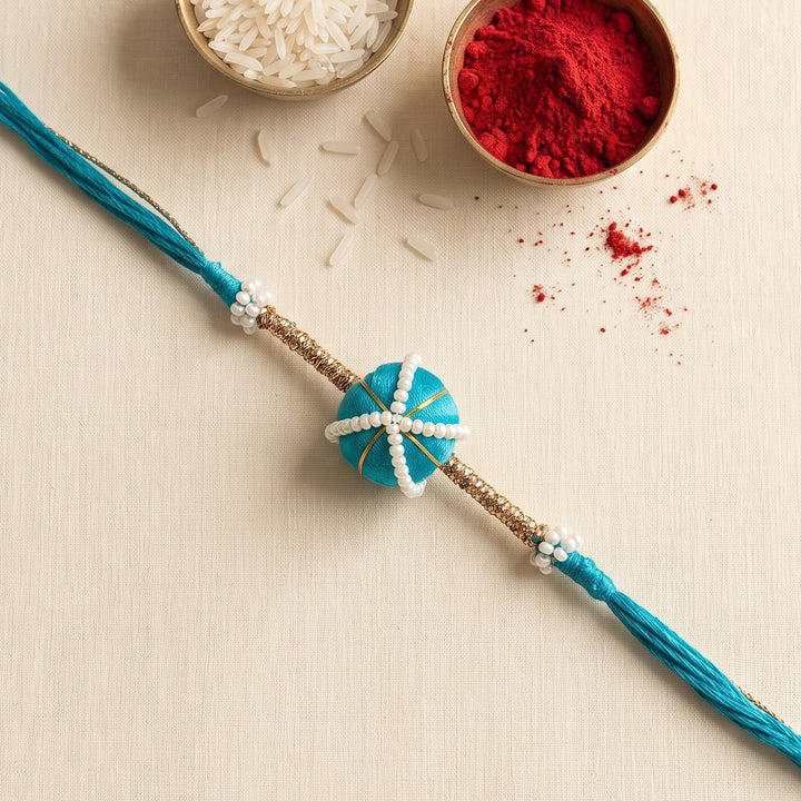 Handmade Silk-Wrapped Bead & Pearl Rakhi For Brother With Roli Chawal