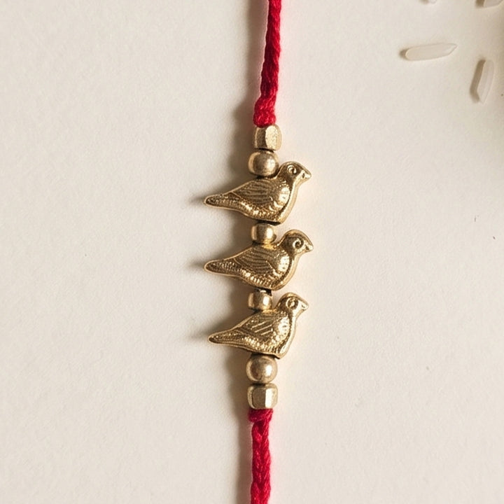 Handcrafted Brass Bird Rakhi With Roli Chawal For Sister