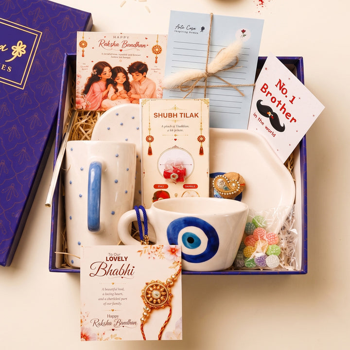 "Nazar Se Surakshit" Evil Eye Ceramic Rakhi Hamper With Mug, Sipper & Roli Chawal For Brother