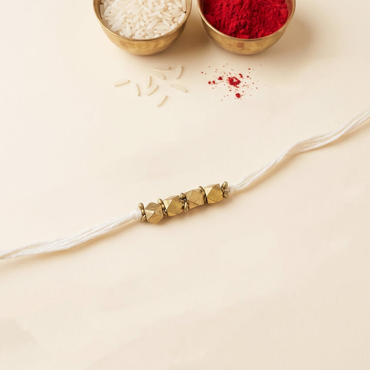 Beaded 4 Brass Beads Rakhi With Roli Chawal For Sister