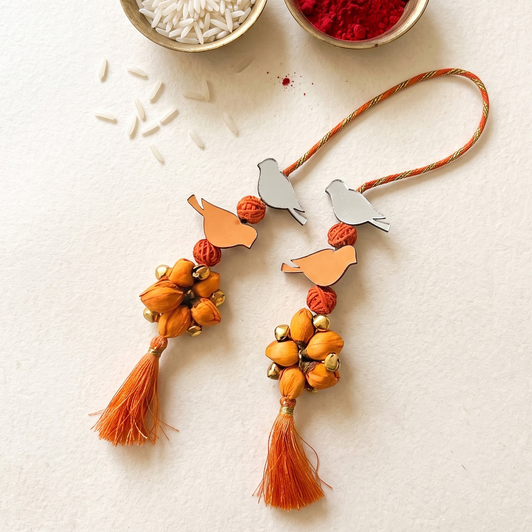 Handcrafted Bird Motif Shola Beaded Tassel Lumba Rakhi for Bhabhi - Orange