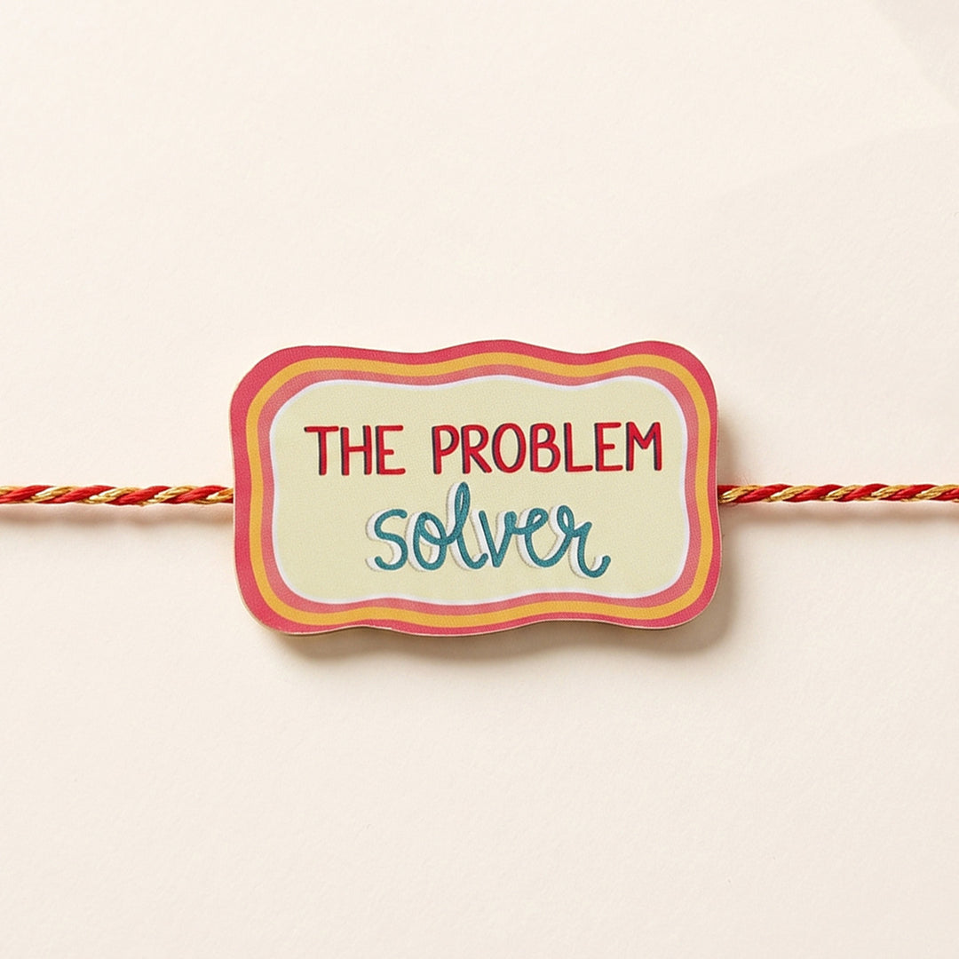 Glossy Printed Wooden 'Problem Solver' Rakhi With Kumkum Rice For Brother