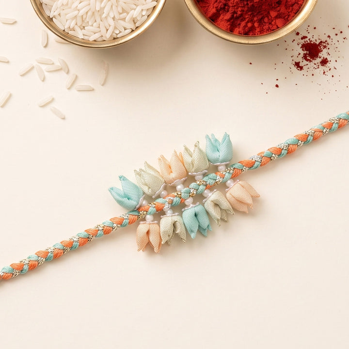 Handmade Pastel Coloured Dual-Tier Tulip Bud & Pearl Silk Rakhi For Brother With Roli Chawal
