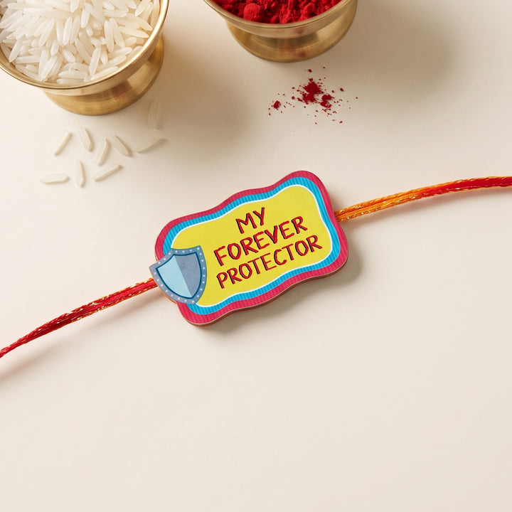 Glossy Printed Wooden 'Forever Protector' Rakhi With Kumkum Rice For Brother