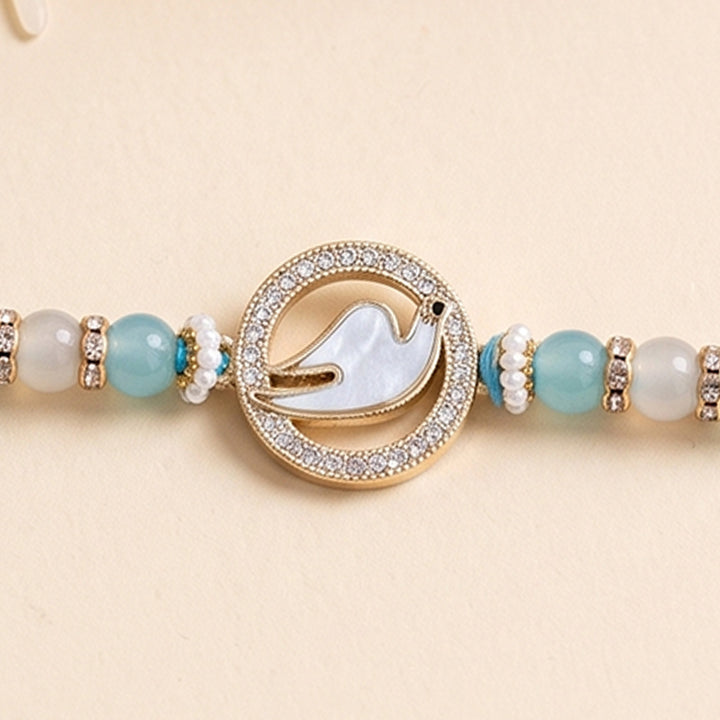 Swan Mother of Pearl Rakhi For Brother With Roli Chawal
