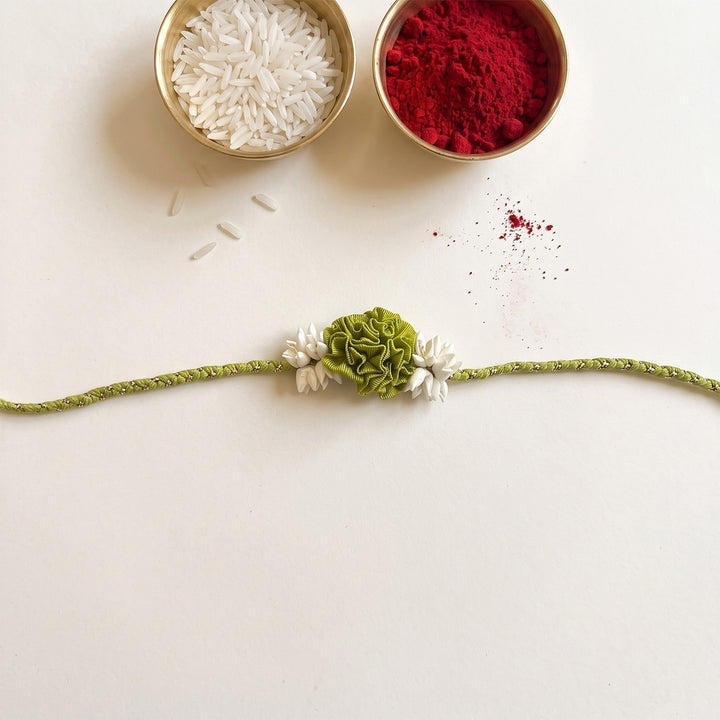 Handcrafted Rose & Mogra Bud Silk Fabric Floral Rakhi For Brother With Roli Chawal