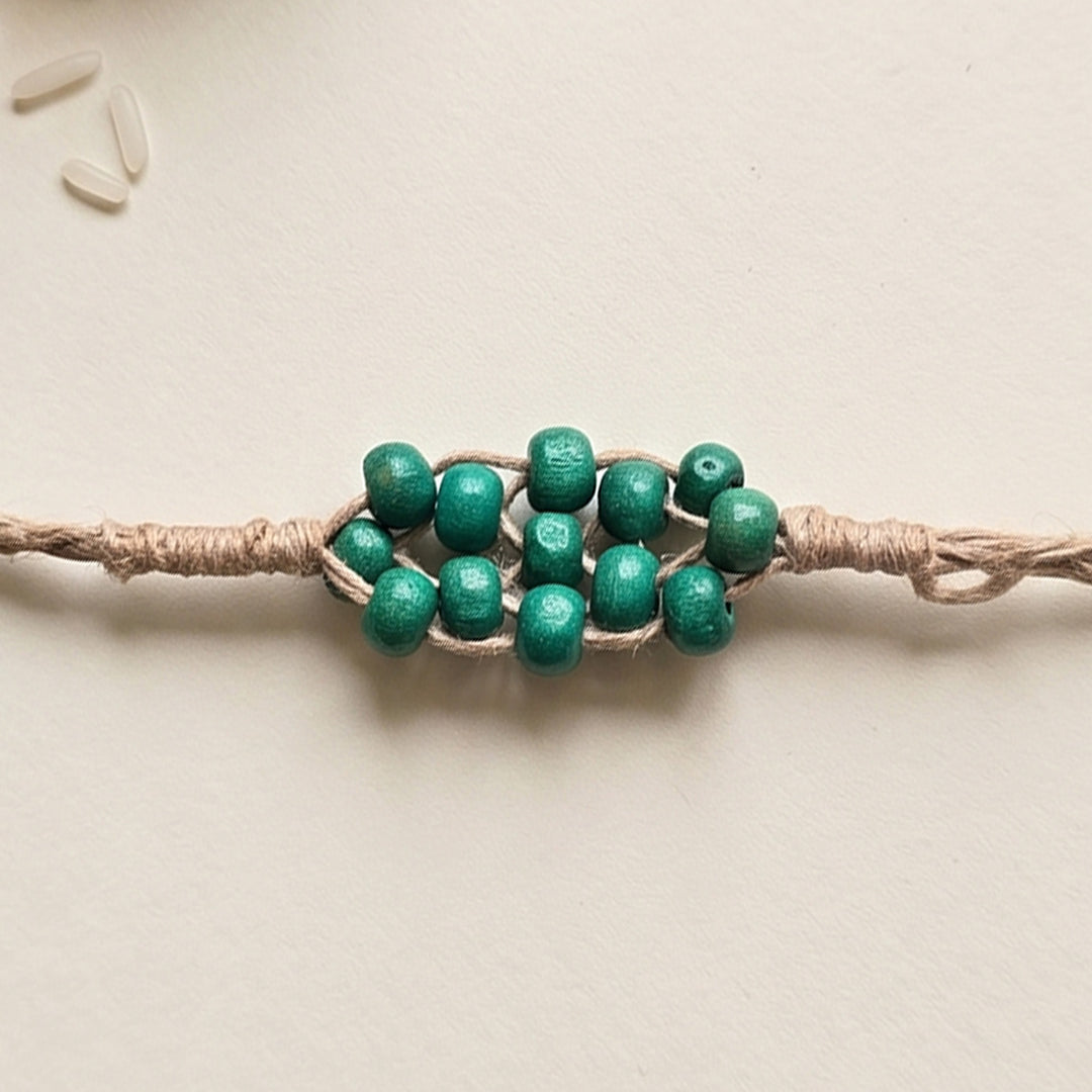 Handcrafted Jute Thread Teal Wood Bead Rakhi For Brother