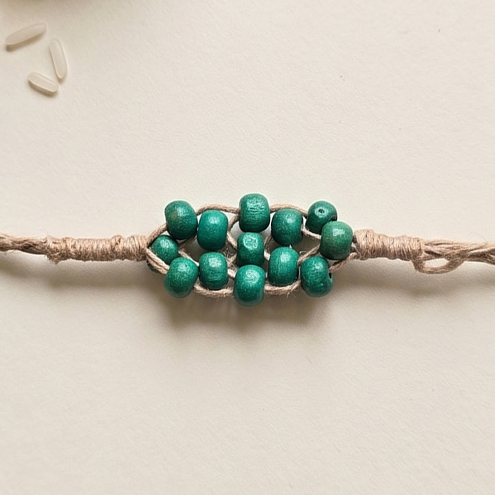 Handcrafted Jute Thread Teal Wood Bead Rakhi For Brother
