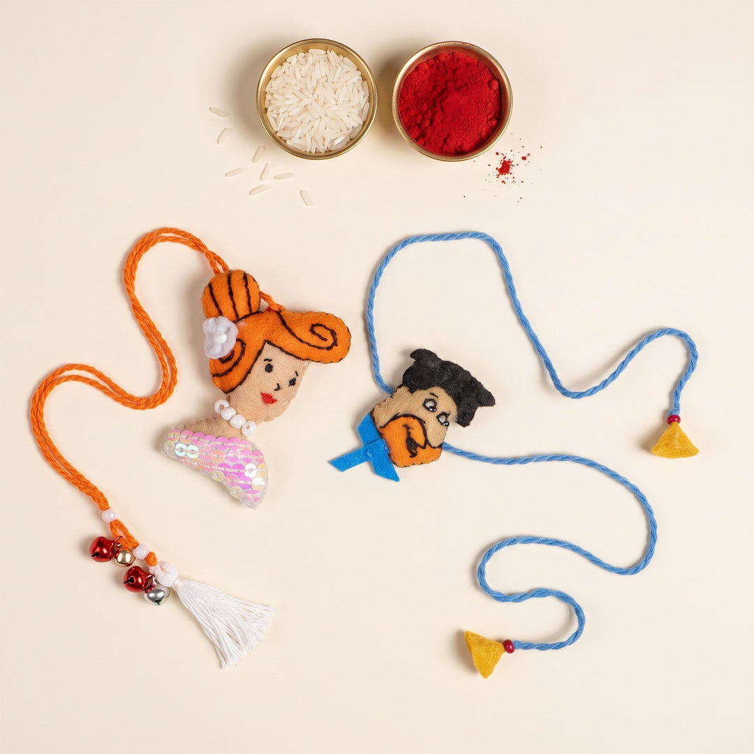 Hand Embroidered Fred & Wilma Couple Rakhi Lumba Set With Brooch Pin, Keychain & Magnet For Bhaiya Bhabhi