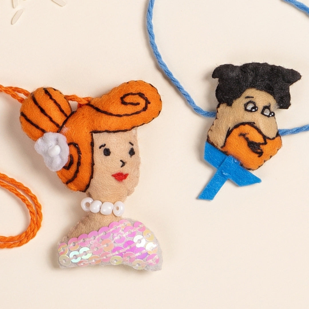Hand Embroidered Fred & Wilma Couple Rakhi Lumba Set With Brooch Pin, Keychain & Magnet For Bhaiya Bhabhi