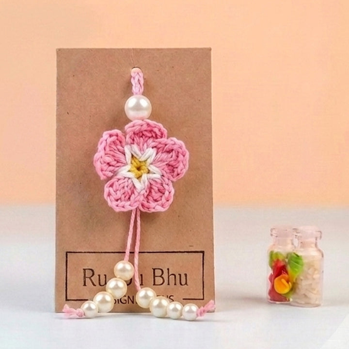 Handmade Crochet Cherry Blossom Lumba Rakhi For Bhabhi With Roli Chawal