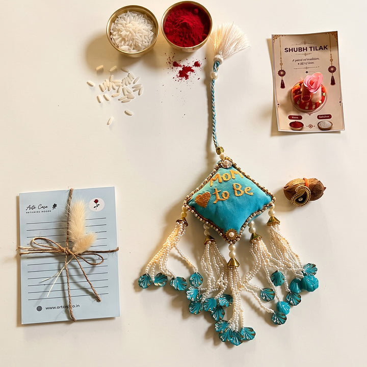 Mom-to-Be Ceramic Rakhi Hamper With Rakhi & Festive Cards For Sister