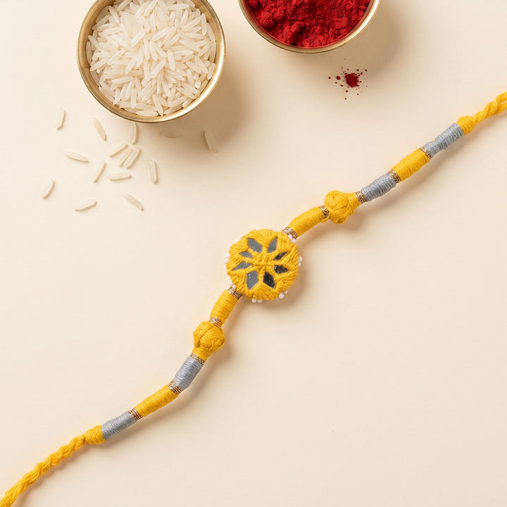 Handmade Mirror Work Patwa Yellow Cotton Rakhi With Roli Chawal