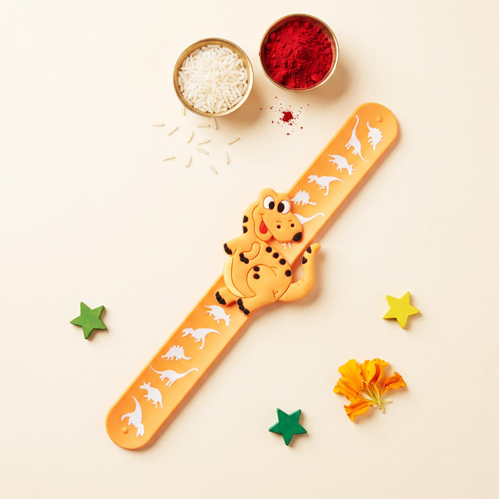 Handmade Orange Dinosaur Silicone Slap Band Rakhi For Kids With Roli Chawal For Brother