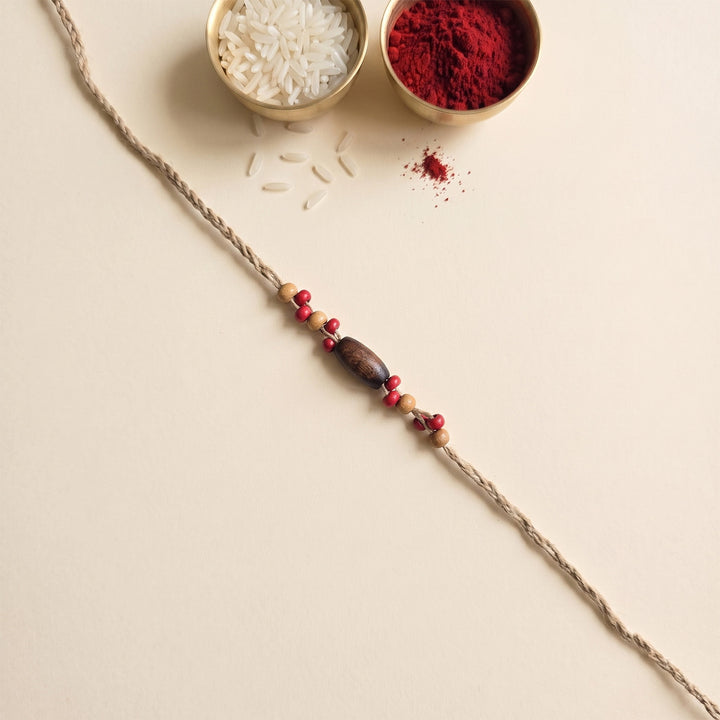 Handcrafted Jute Thread Brown & Red Wood Bead Rakhi For Brother