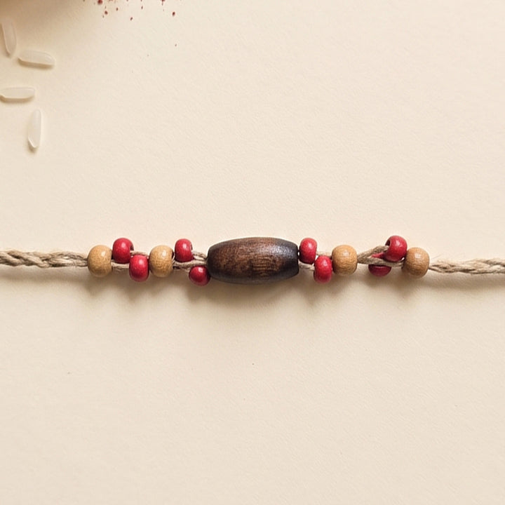 Handcrafted Jute Thread Brown & Red Wood Bead Rakhi For Brother