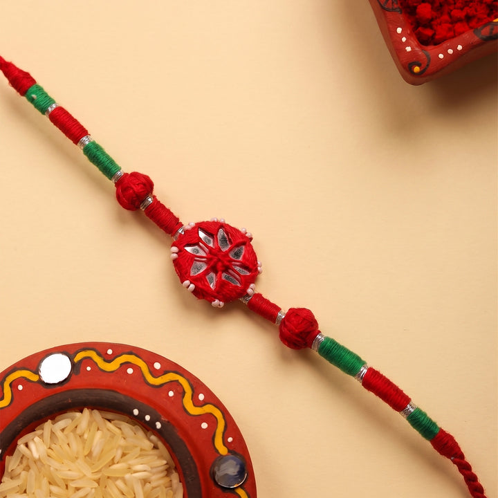 Handmade Mirror Work Patwa Maroon Cotton Rakhi With Roli Chawal