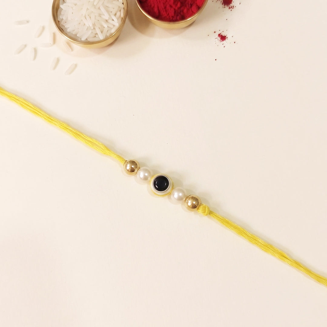 Handmade Evil Eye Yellow Premium Agate Rakhi With Roli Chawal, Nariyal And Gift Box For Brother