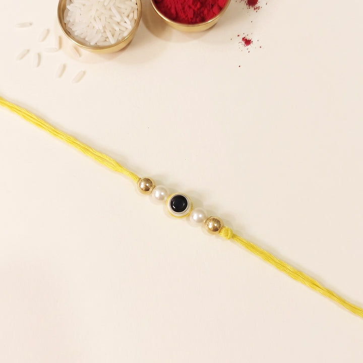 Handmade Evil Eye Yellow Premium Agate Rakhi With Roli Chawal, Nariyal And Gift Box For Brother