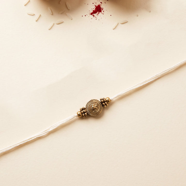 Beaded Diamond & Charm Brass Rakhi With Roli Chawal For Brother