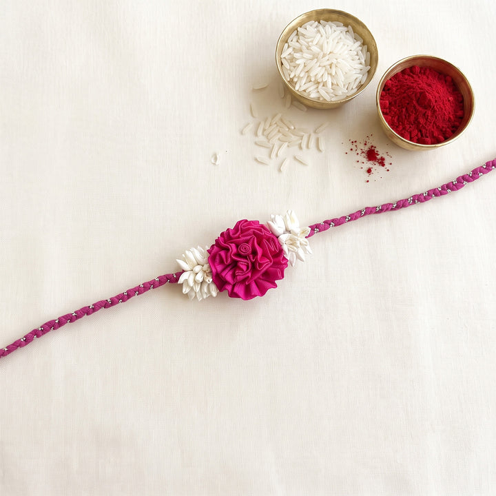 Handcrafted Rose & Mogra Bud Silk Fabric Floral Rakhi For Brother With Roli Chawal