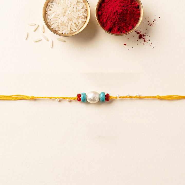 Handcrafted Pearls & Stones Rakhi With Roli Chawal For Brother