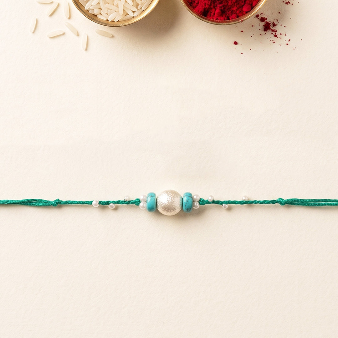 Handcrafted Pearls & Stones Rakhi With Roli Chawal For Brother