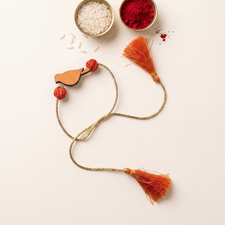 Handcrafted Bird Motif Beaded Tassel Rakhi - Orange