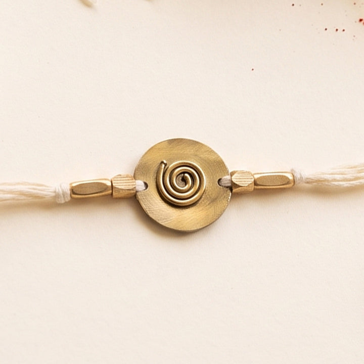 Handcrafted Spiral Brass Charm Rakhi With Roli Chawal For Brother