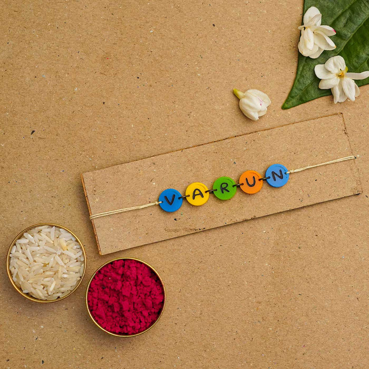 Personalized Handmade Gems Acrylic Rakhi With Roli Chawal - Name bead bracelet with rice and flowers (6)