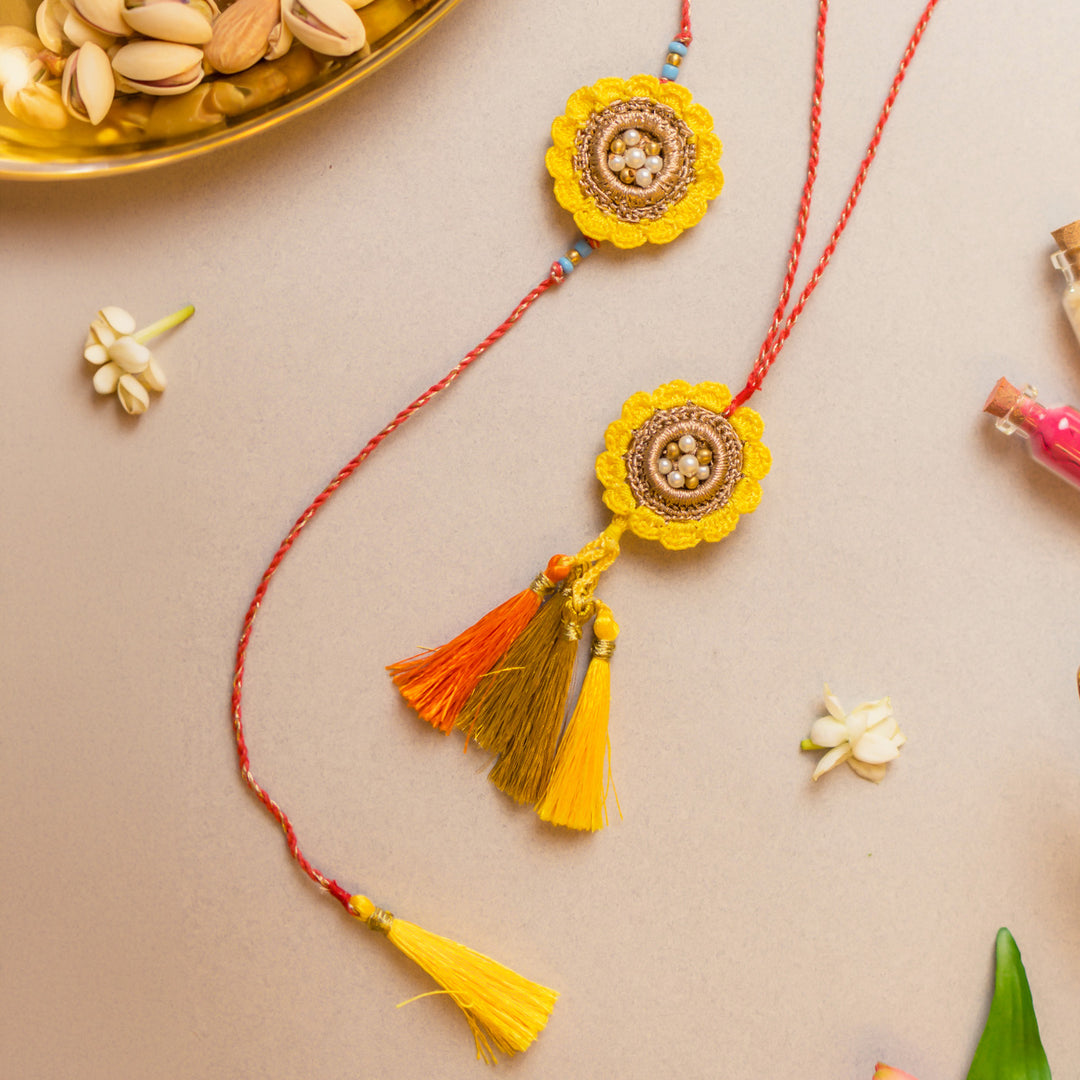 Intricate Crochet Marigold Bhaiya Bhabhi Rakhi-Lumba Set With Roli Chawal | Set of 2